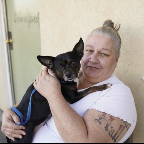 Woman holding her dog