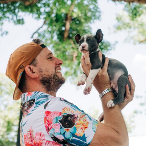 Man holding puppy